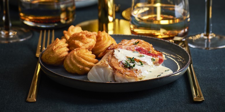 Kabeljauw met pancetta en romige mosterd-tijmsaus