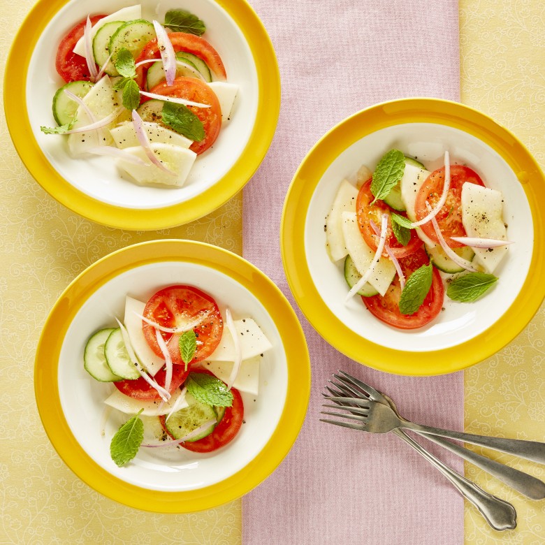 Tomaten-meloensalade met gember en munt