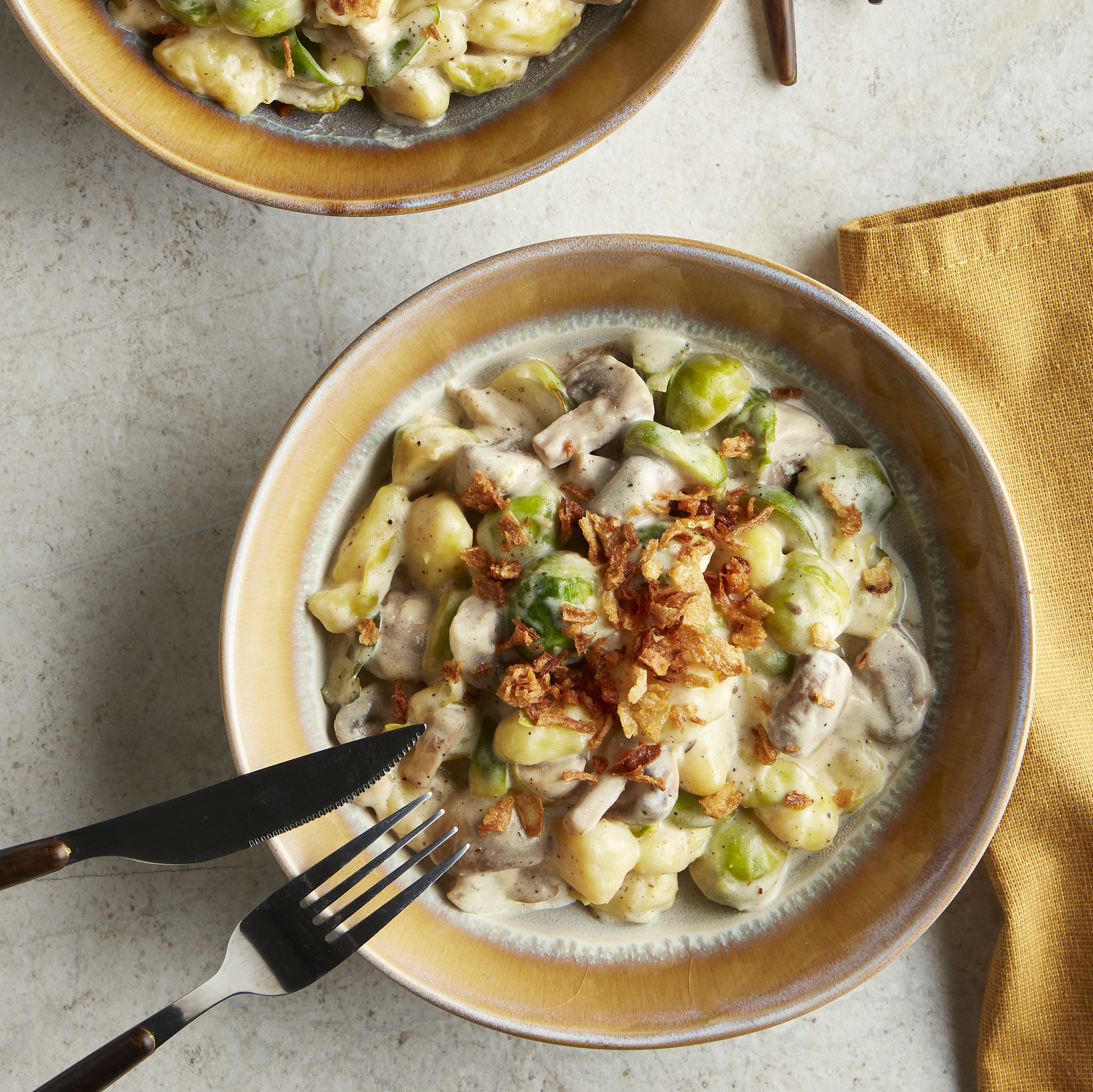 Romige gnocchi met champignons en spruitjes